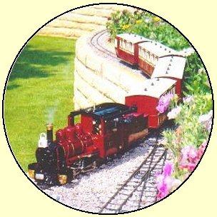 a red loco on a garden railway