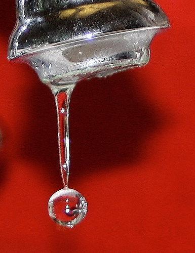 Photo of water dripping from a tap